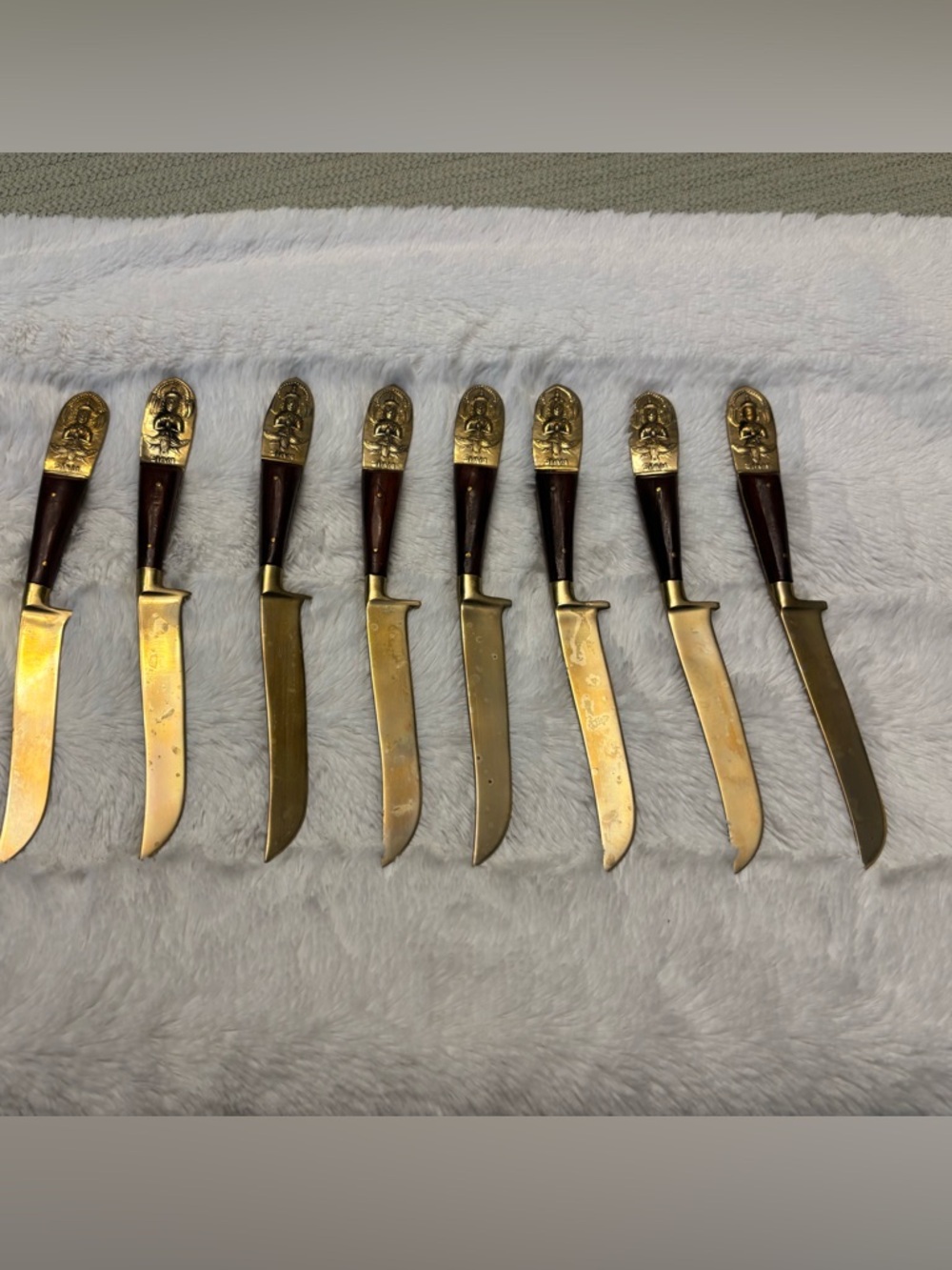 Set of eight vintage Siam Buddah wood and brass steak knives